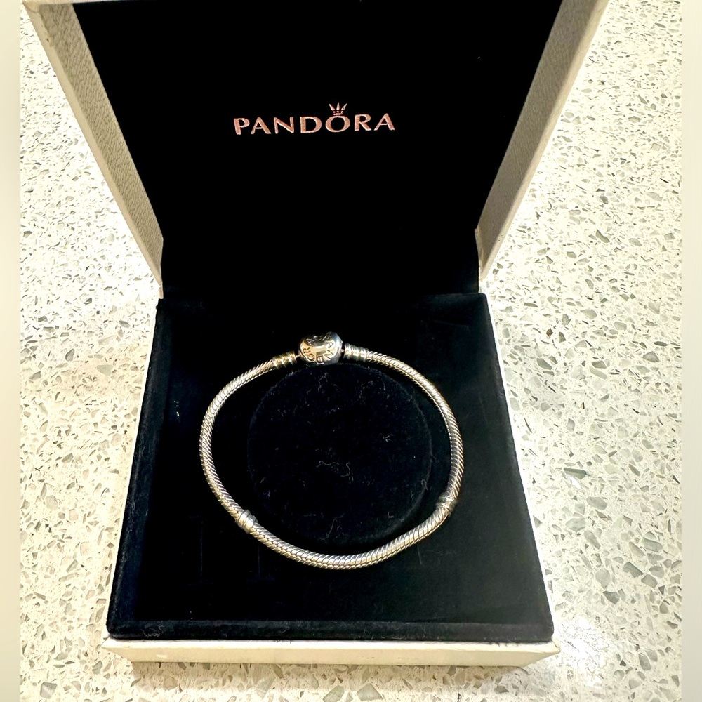 Pandora silver charm bracelet with heart clasp.  7 inches.